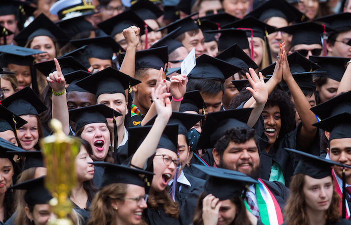 Image of the graduates sitting watching the Special Ceremony for the Classes of 2020 and 2021