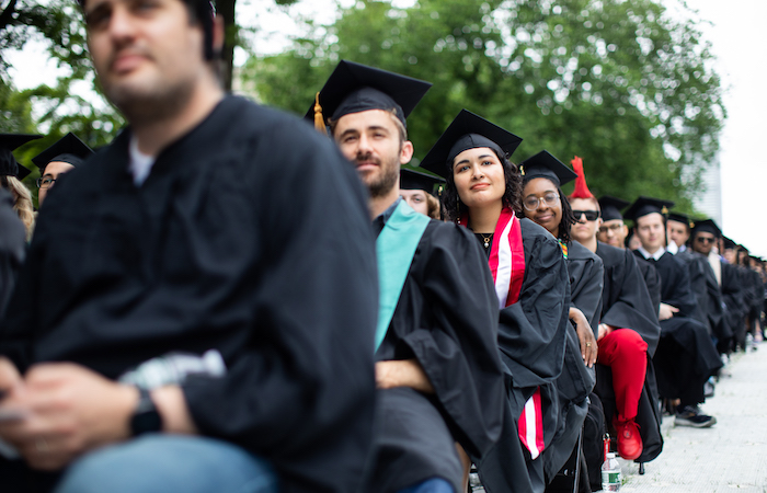 Image of the graduates sitting watching the Special Ceremony for the Classes of 2020 and 2021