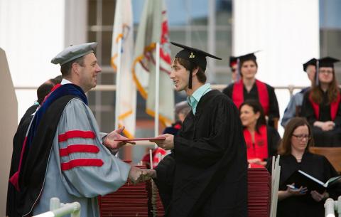 Provost Martin A. Schmidt SM '83 PhD '88 presents a degree. 