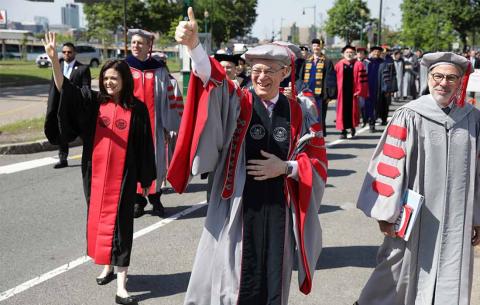 Guest speaker Sheryl Sandberg, President Rafael Reif, and Corporation chairman Bob Millard '73 greet the class of 1968 as they make their way to Killian Court