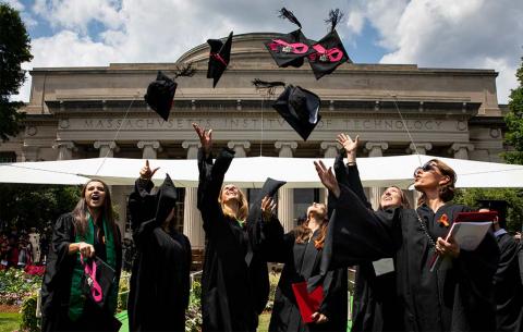 Graduates tossing their caps