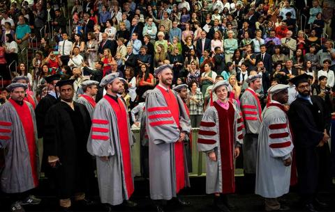 Candidates enter the ceremony venue during the procession