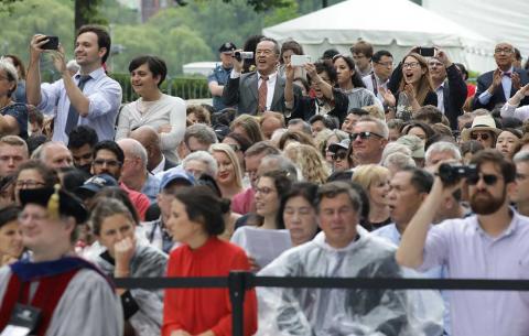 Image of audience cheering and taking photos; photo: Dominick Reuter