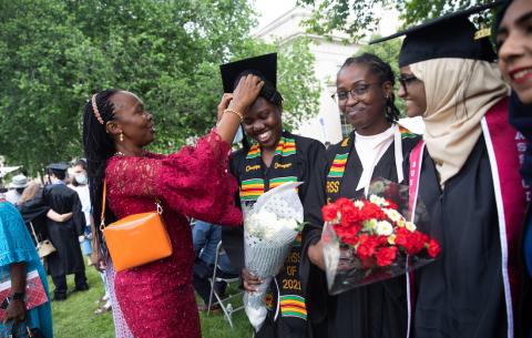 Image of family member fixing a graduate's cap