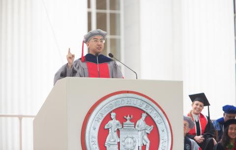 Image of Chengzhao "Richard" Zhang delivering the salute from the graduate class of 2021